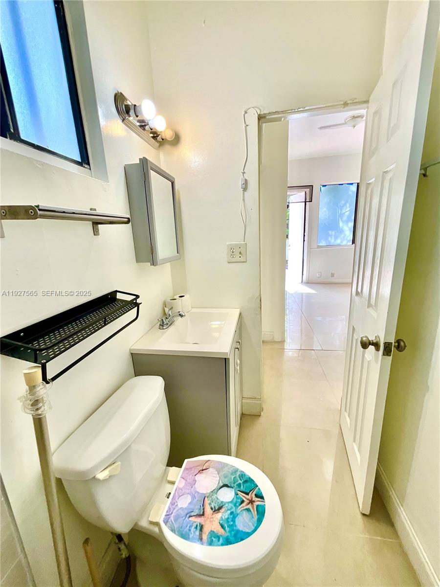 2516 Cleveland Street Hollywood, FL 33020 - Photo 34 of 42 a bathroom with a sink toilet and mirror