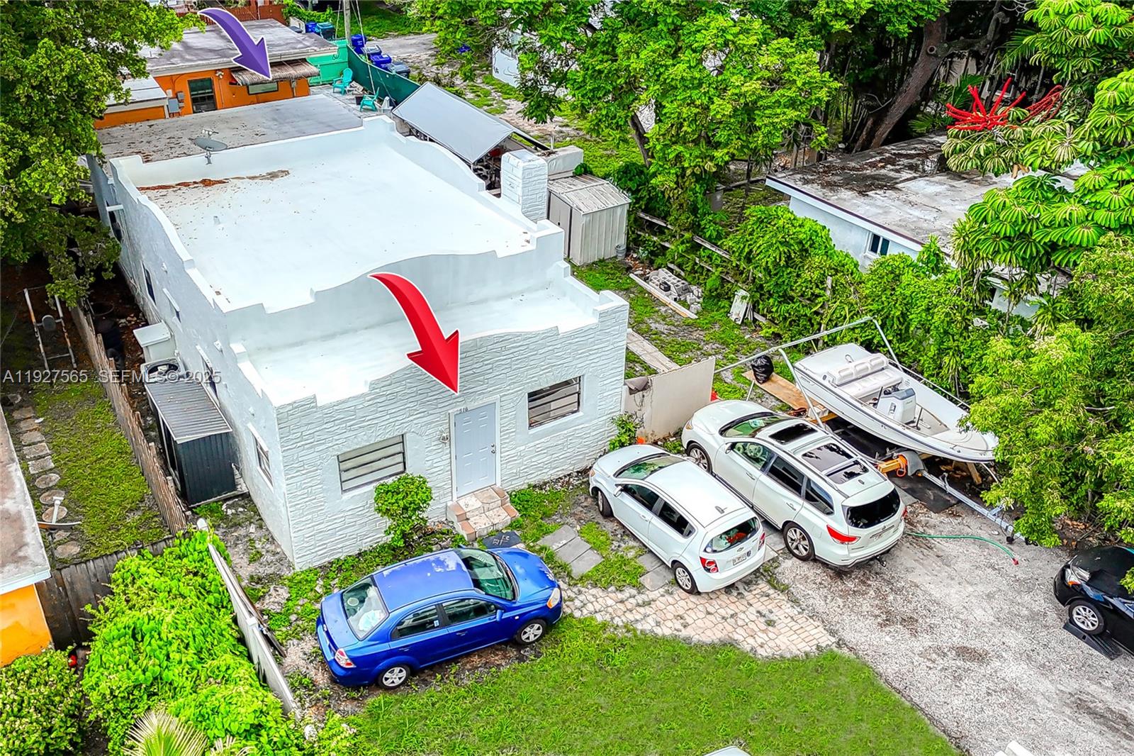 2516 Cleveland Street Hollywood, FL 33020 - Photo 39 of 42 an aerial view of a house with a garden and trees