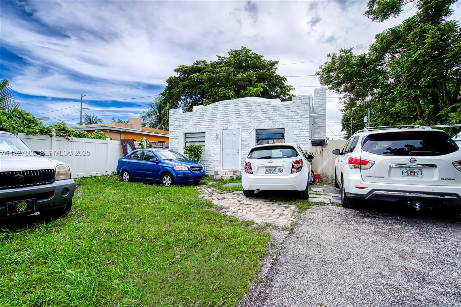 2516 Cleveland Street Hollywood, FL 33020 - Photo 42 of 42 a white car parked in a big yard