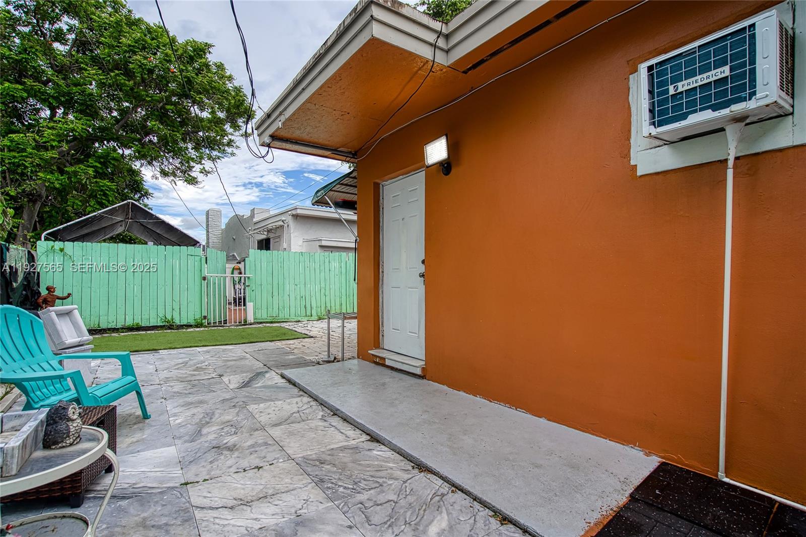 2516 Cleveland Street Hollywood, FL 33020 - Photo 7 of 42 a view of a backyard with a tub and wooden fence