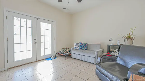 a living room with furniture and next to a window