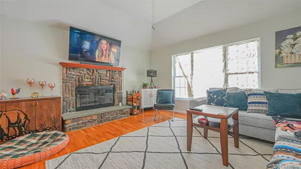 a reading room with furniture and a fireplace
