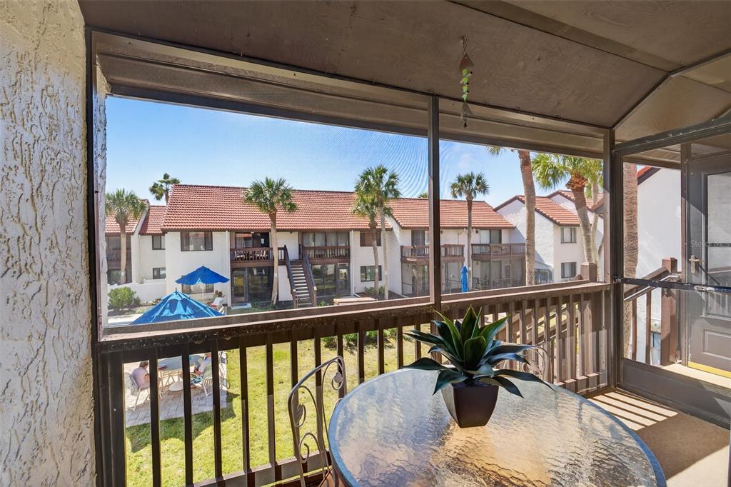 1632 Stickney Point Road, Unit 201 Sarasota, FL 34231 - Photo 14 of 43 a view of a balcony with furniture