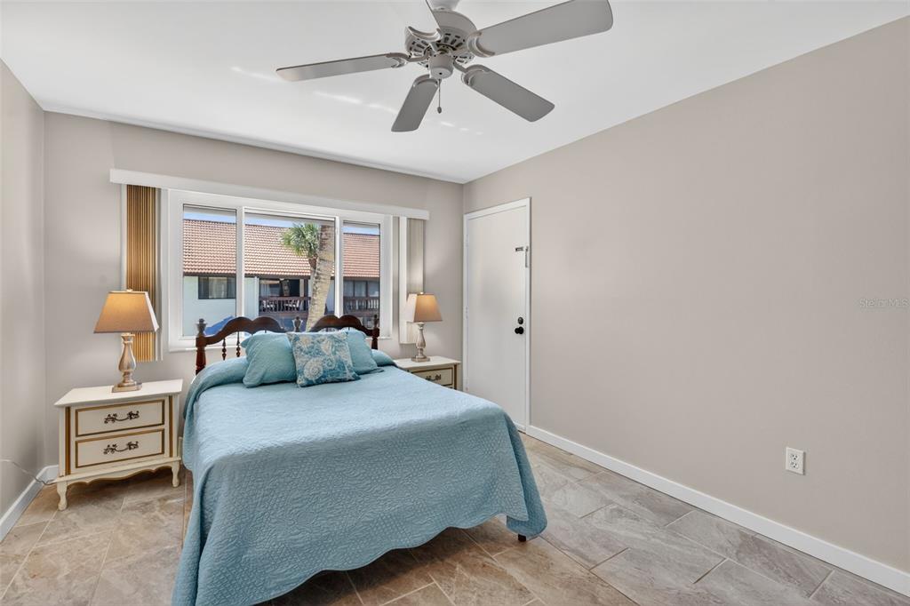 1632 Stickney Point Road, Unit 201 Sarasota, FL 34231 - Photo 17 of 43 a bedroom with a bed and a window