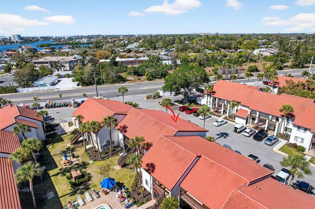 1632 Stickney Point Road, Unit 201 Sarasota, FL 34231 - Photo 40 of 43 an aerial view of a houses with outdoor space