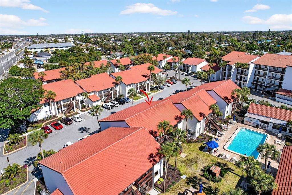 1632 Stickney Point Road, Unit 201 Sarasota, FL 34231 - Photo 41 of 43 an aerial view of residential houses with outdoor space