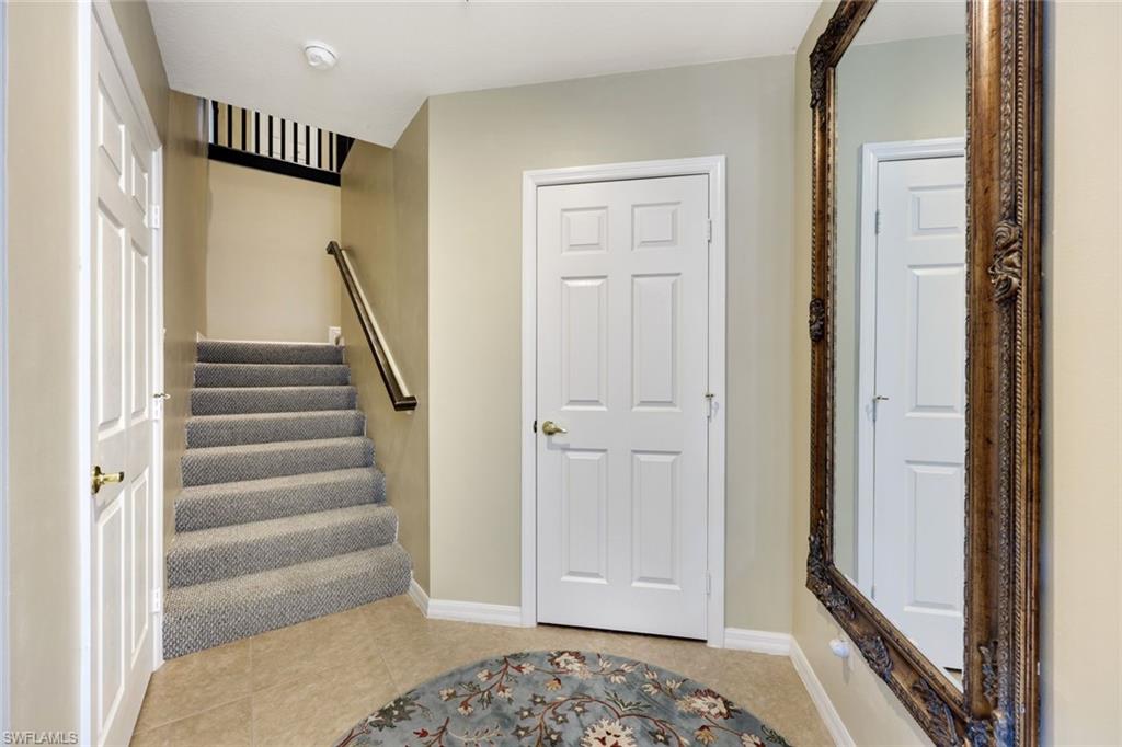 3530 Lansing Loop, Unit 202 Estero, FL 33928 - Photo 12 of 35 a view of front door with stairs