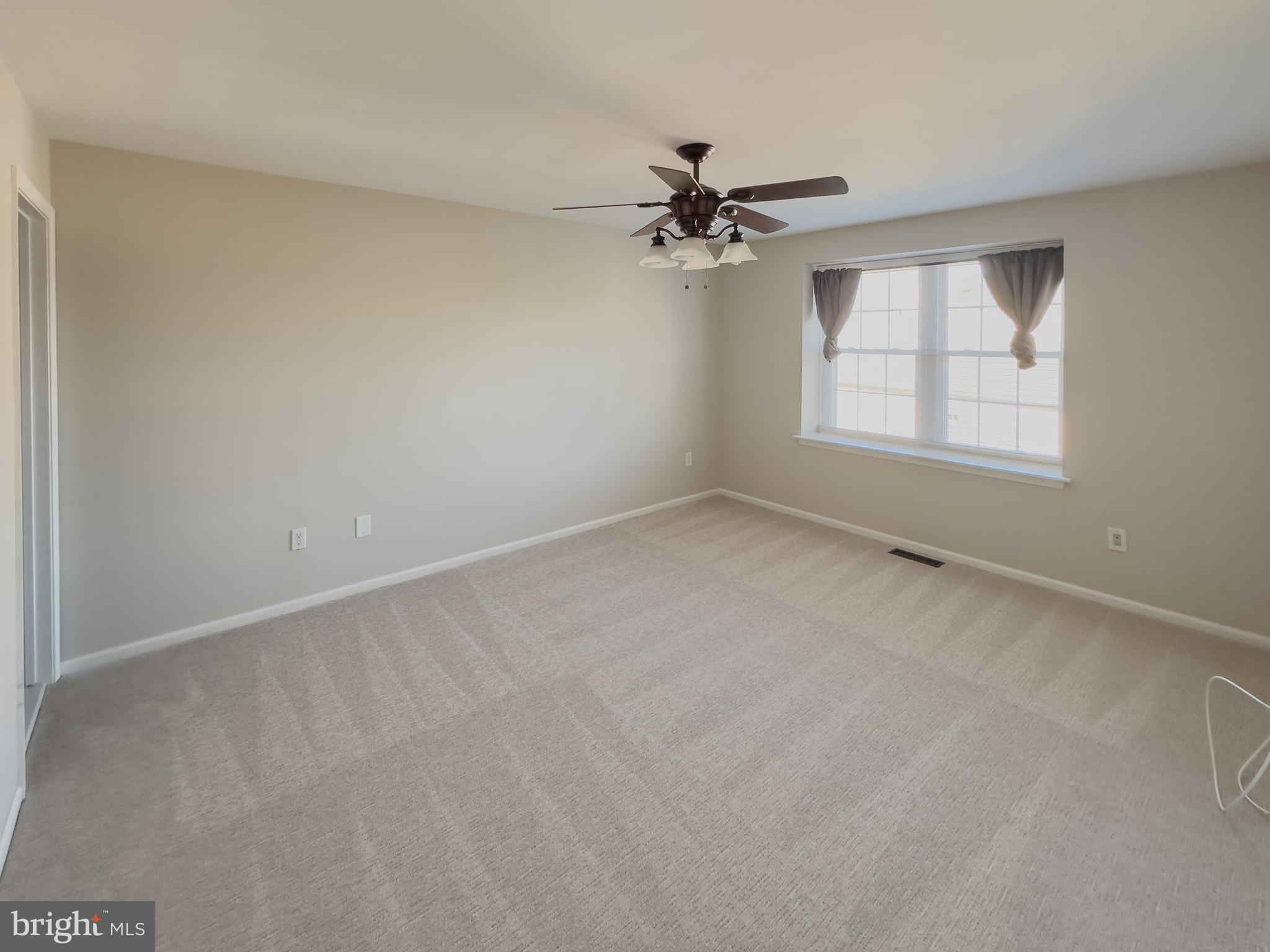 806 Wharton Road Mount Laurel, NJ 08054 - Photo 20 of 25 an empty room with a window and a fan