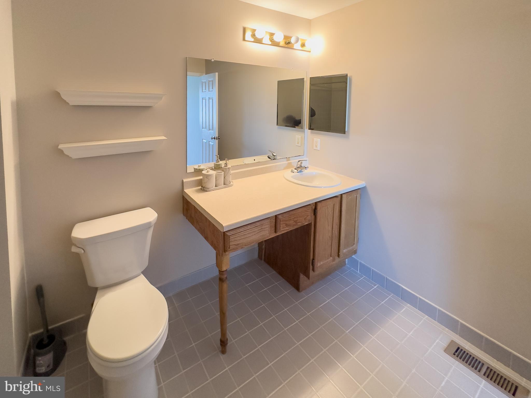 806 Wharton Road Mount Laurel, NJ 08054 - Photo 25 of 25 a bathroom with a toilet sink and mirror