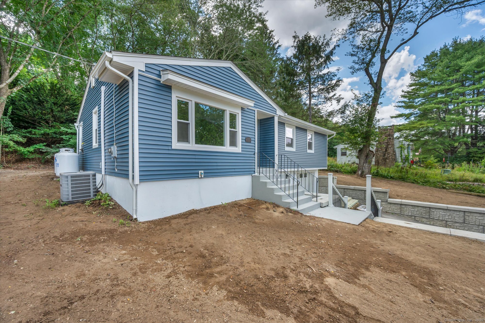 9 Sunset Avenue Ledyard, CT 06339 - Photo 1 of 1 a view of house with backyard and trees