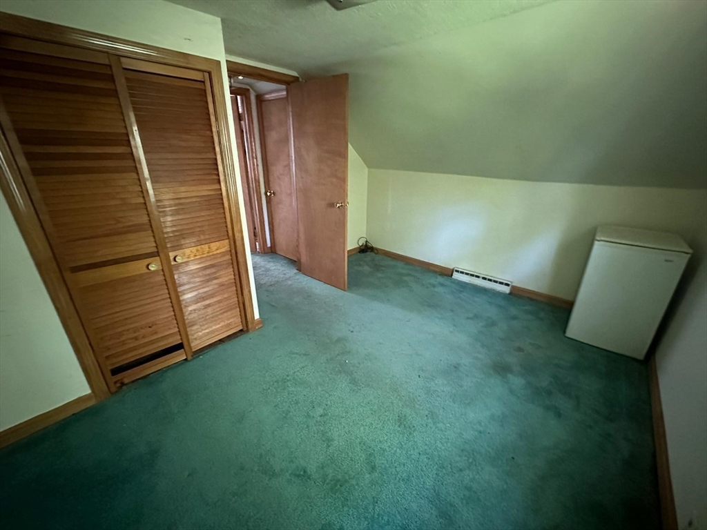 133 Salem Road Billerica, MA 01821 - Photo 25 of 32 a view of an empty room with wooden floor and a window