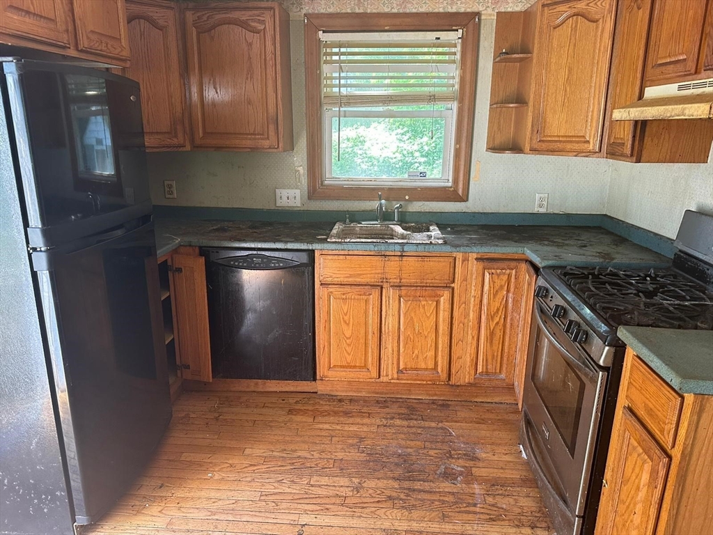 133 Salem Road Billerica, MA 01821 - Photo 9 of 32 a kitchen with stainless steel appliances granite countertop a refrigerator and a sink