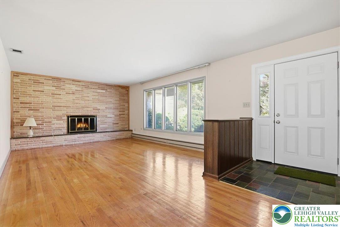4395 East Texas Road Allentown, PA 18103 - Photo 13 of 81 a view of an empty room with wooden floor and a window
