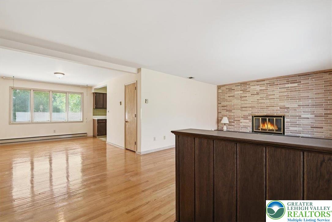 4395 East Texas Road Allentown, PA 18103 - Photo 16 of 81 a view of a livingroom with wooden floor and a window