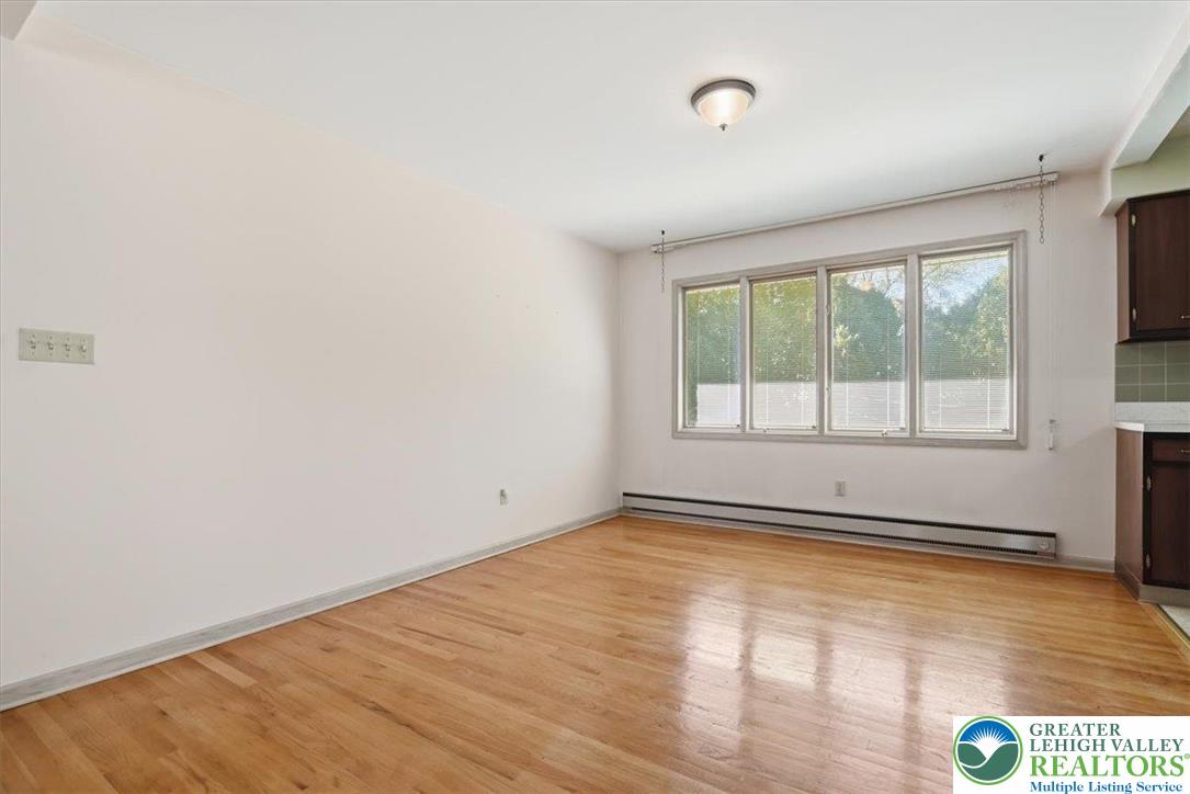 4395 East Texas Road Allentown, PA 18103 - Photo 20 of 81 an empty room with wooden floor and windows