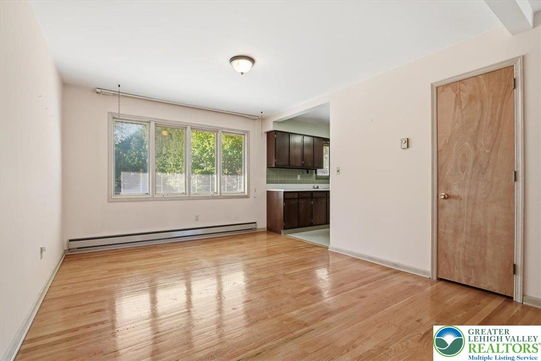 4395 East Texas Road Allentown, PA 18103 - Photo 21 of 81 a view of an empty room with a window and wooden floor