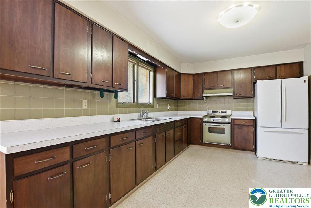 4395 East Texas Road Allentown, PA 18103 - Photo 25 of 81 a kitchen with stainless steel appliances granite countertop a refrigerator sink and stove
