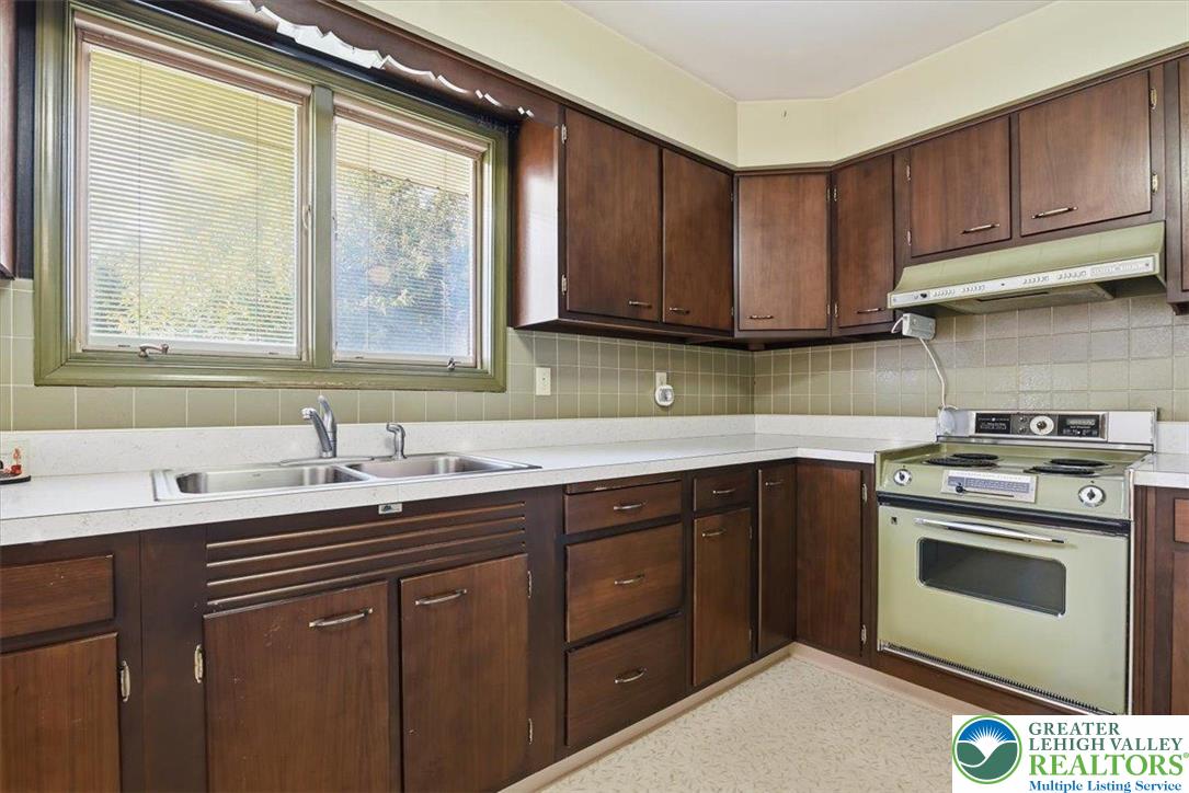 4395 East Texas Road Allentown, PA 18103 - Photo 29 of 81 a kitchen with a sink stove and cabinets