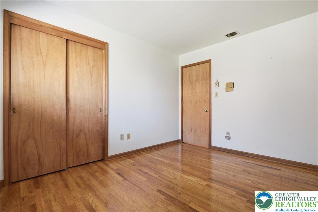 4395 East Texas Road Allentown, PA 18103 - Photo 33 of 81 an empty room with wooden floor and windows
