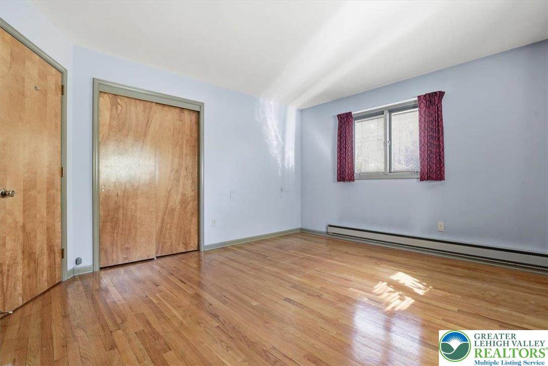 4395 East Texas Road Allentown, PA 18103 - Photo 35 of 81 a view of an empty room with wooden floor and a window