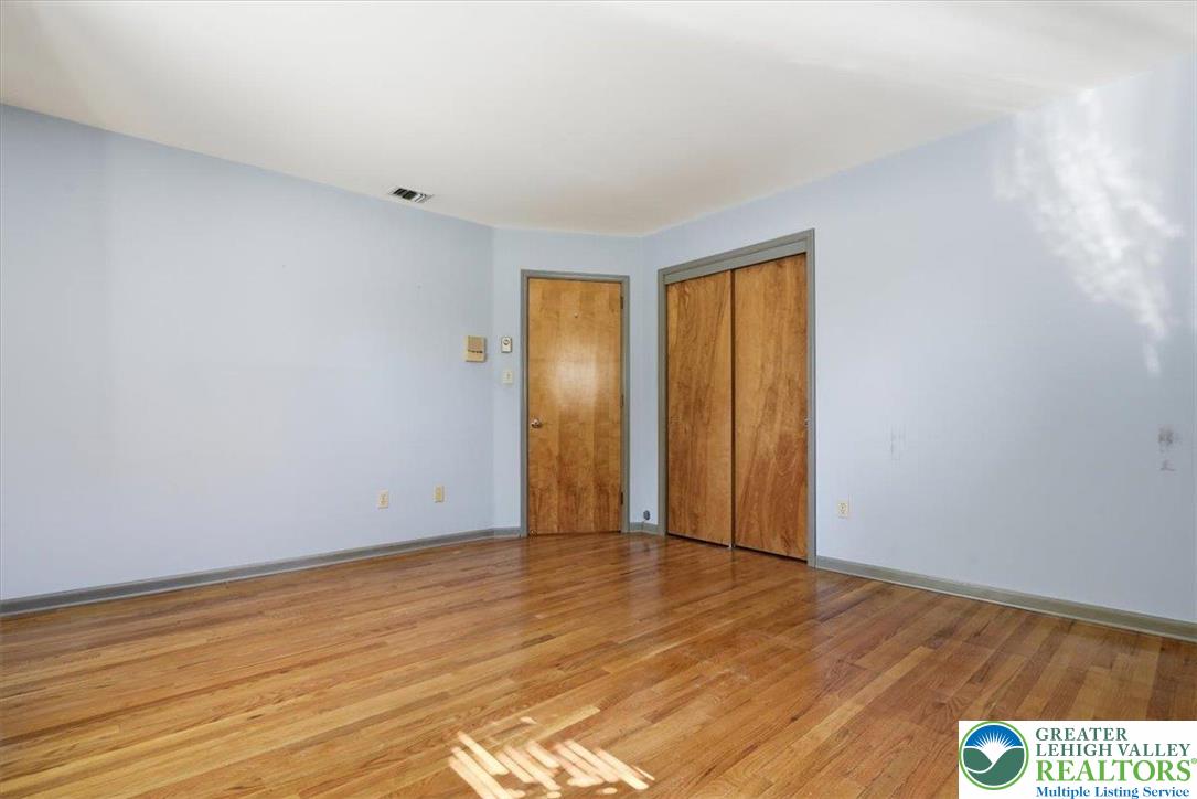 4395 East Texas Road Allentown, PA 18103 - Photo 36 of 81 a view of an empty room with wooden floor