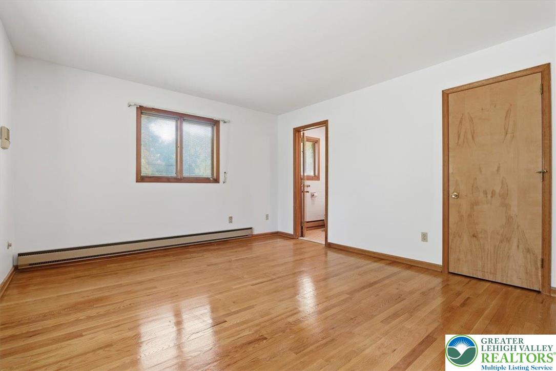 4395 East Texas Road Allentown, PA 18103 - Photo 38 of 81 an empty room with wooden floor and windows