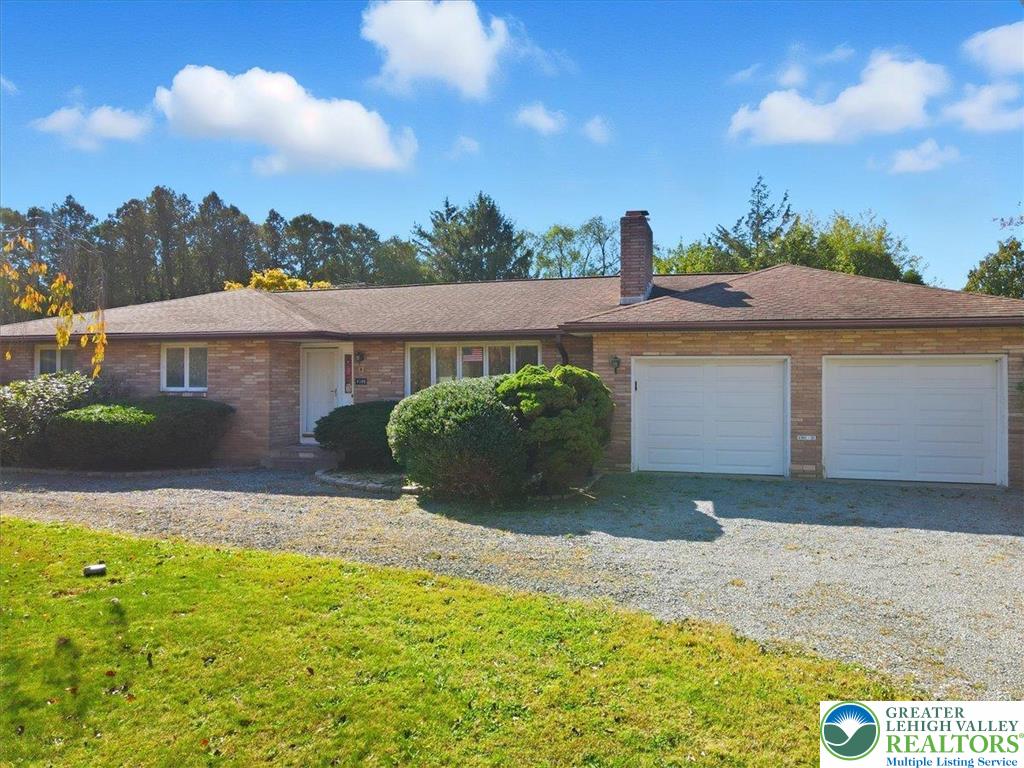 4395 East Texas Road Allentown, PA 18103 - Photo 4 of 81 a front view of a house with a yard and garage