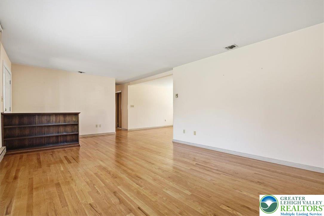 4395 East Texas Road Allentown, PA 18103 - Photo 41 of 81 a view of an empty room with wooden floor and a window
