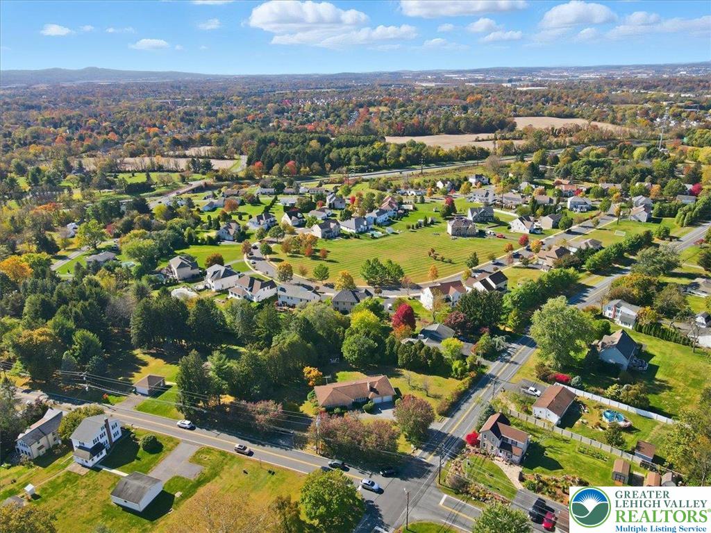 4395 East Texas Road Allentown, PA 18103 - Photo 76 of 81 an aerial view of residential houses with outdoor space and trees