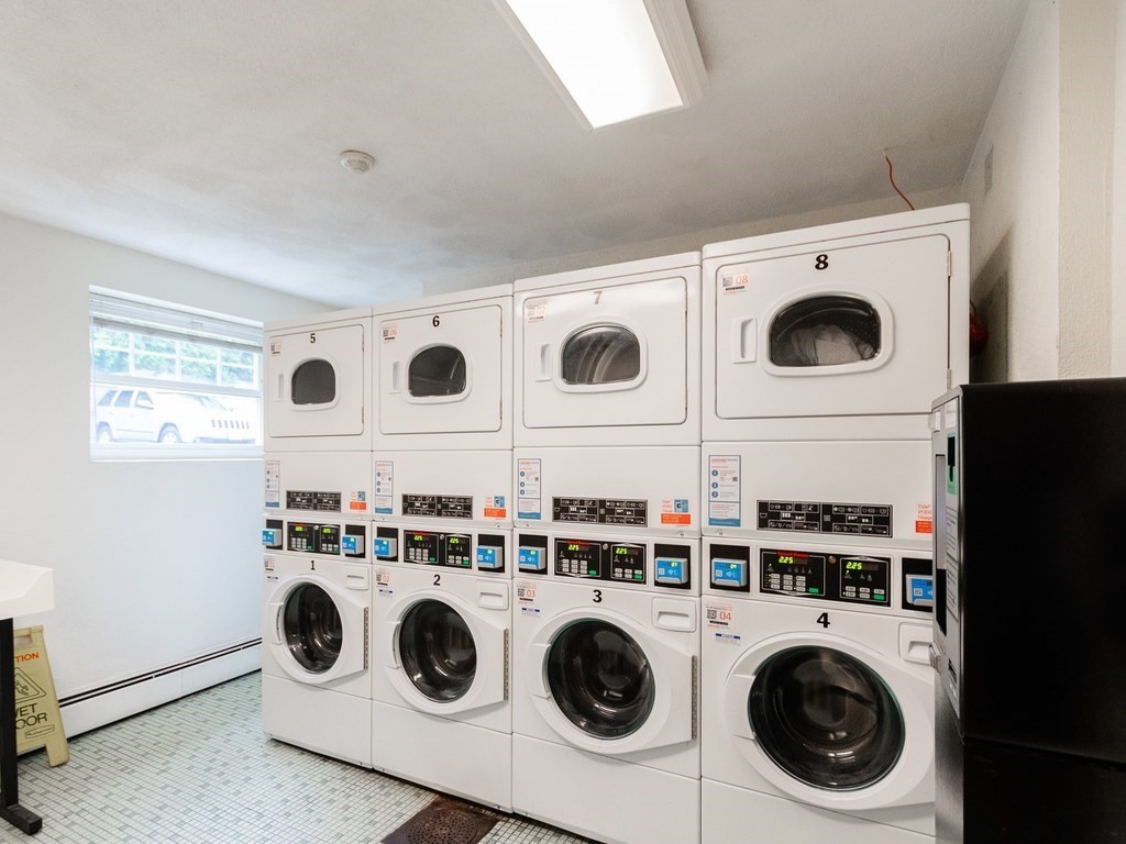48 Coffey Street, Unit 5B Boston, MA 02122 - Photo 21 of 31 a utility room with dryer and washer