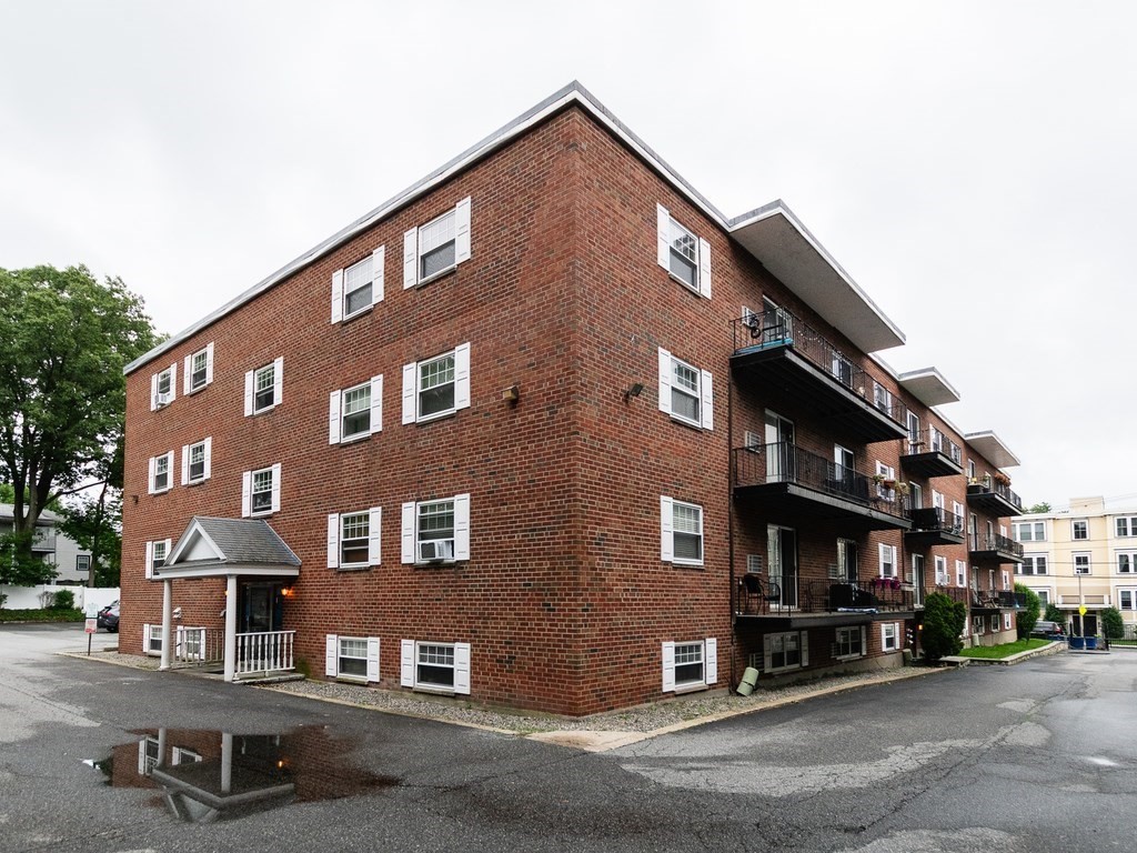 48 Coffey Street, Unit 5B Boston, MA 02122 - Photo 26 of 31 a front view of a building with street