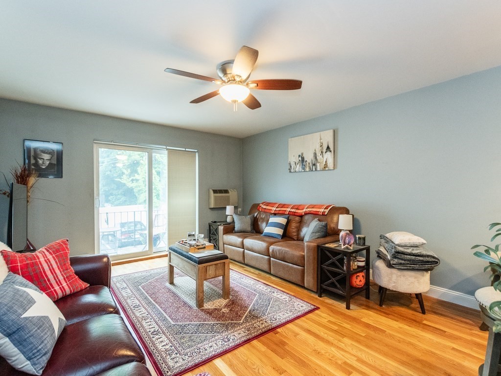 48 Coffey Street, Unit 5B Boston, MA 02122 - Photo 3 of 31 a living room with furniture and a window