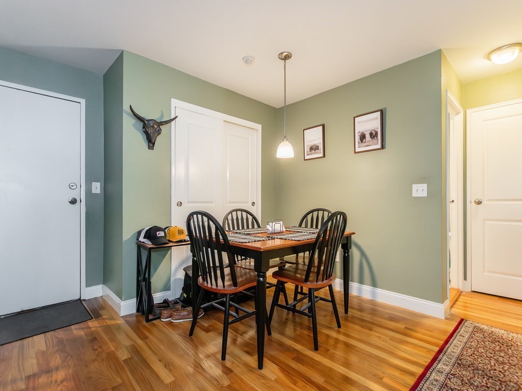 48 Coffey Street, Unit 5B Boston, MA 02122 - Photo 6 of 31 a view of a dining room with furniture and wooden floor