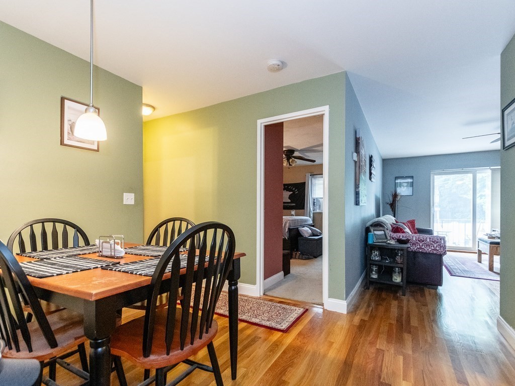 48 Coffey Street, Unit 5B Boston, MA 02122 - Photo 7 of 31 a view of a dining room with furniture and wooden floor