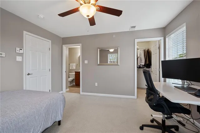 a view of a livingroom with workspace and a window