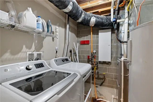 a utility room with dryer and washer