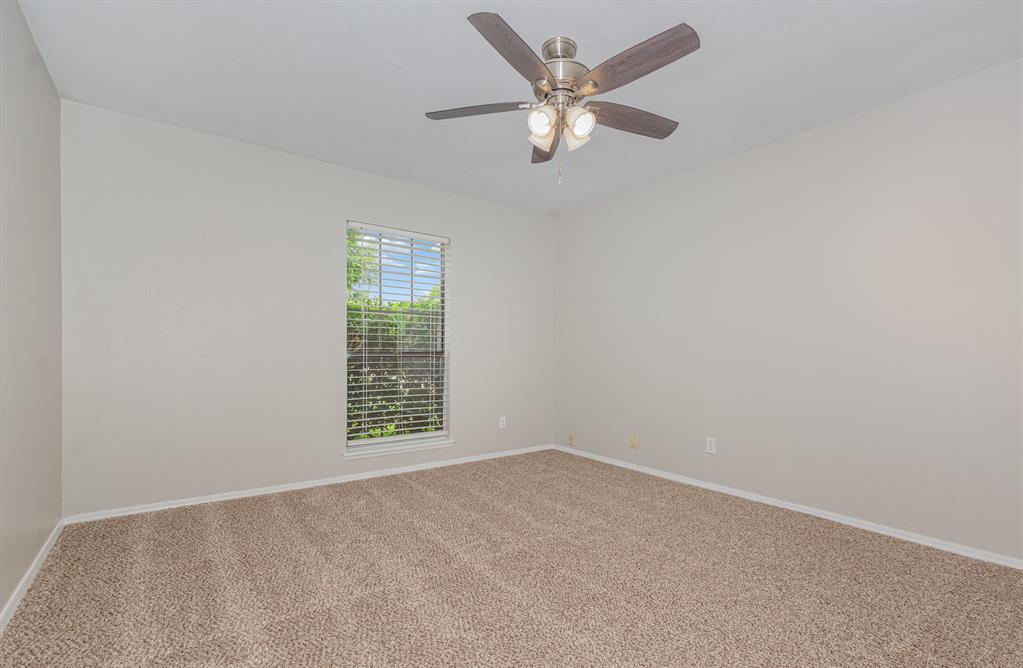 5549 Ragan Drive The Colony, TX 75056 - Photo 12 of 22 an empty room with a window