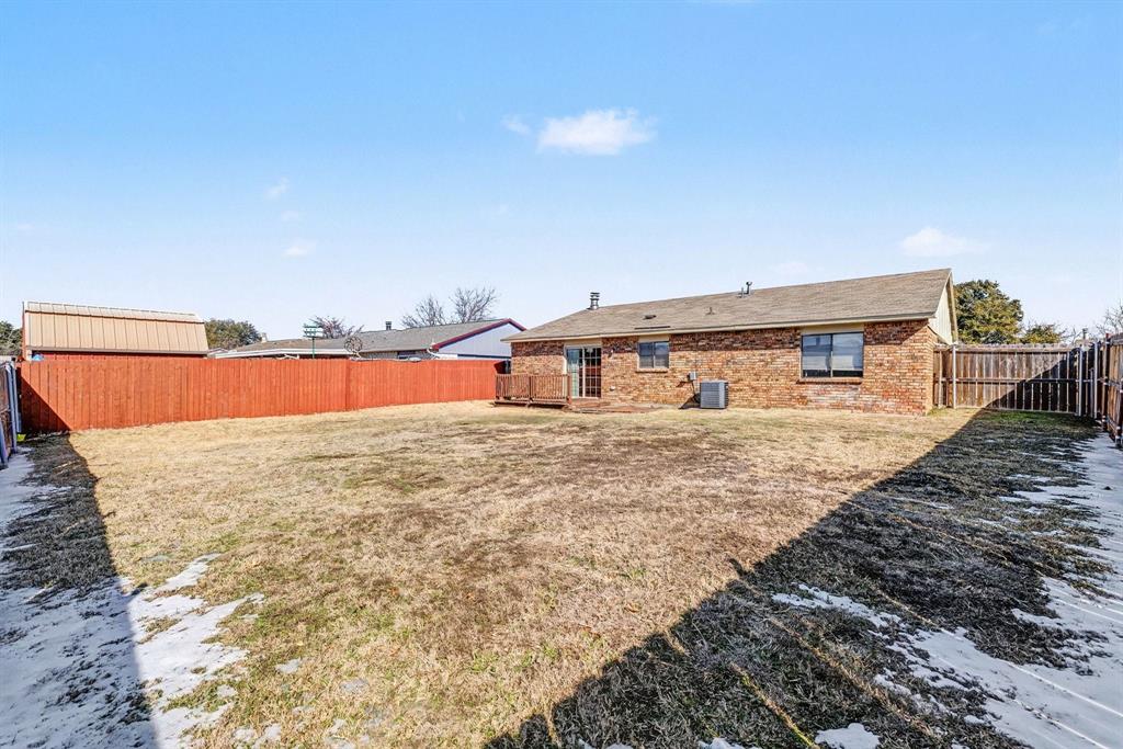 5549 Ragan Drive The Colony, TX 75056 - Photo 19 of 22 a front view of a house with a yard