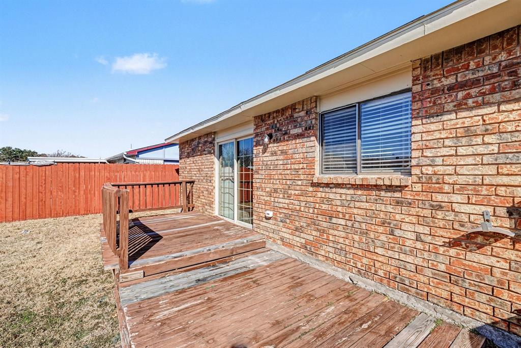 5549 Ragan Drive The Colony, TX 75056 - Photo 20 of 22 a backyard of a house with seating space