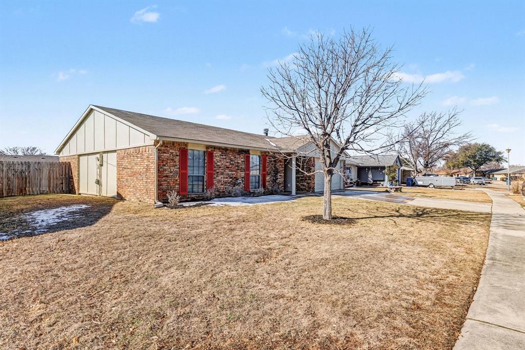 5549 Ragan Drive The Colony, TX 75056 - Photo 22 of 22 a house with trees in front of it