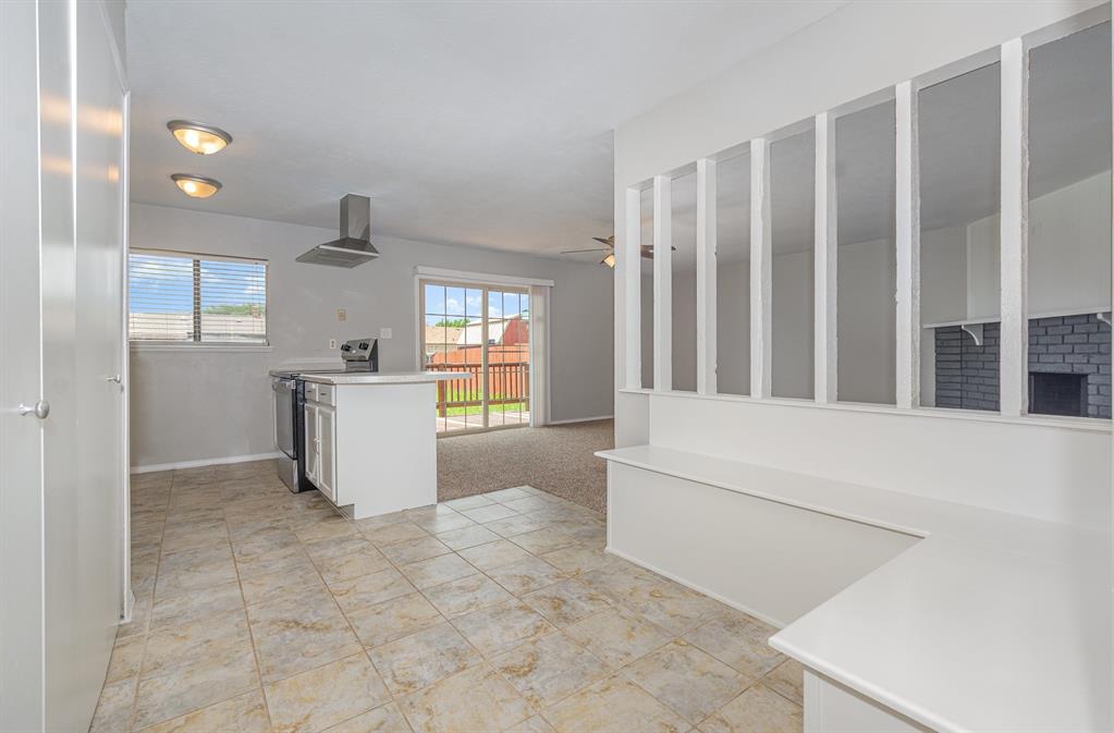 5549 Ragan Drive The Colony, TX 75056 - Photo 8 of 22 a view of kitchen with furniture and cabinets