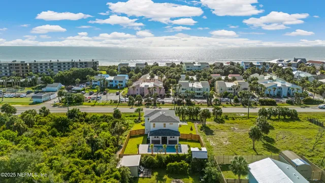 a large kitchen with stainless steel appliances lots of counter space and a sink
