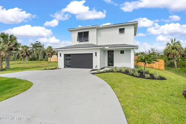 a view of entryway with wooden floor and stairs