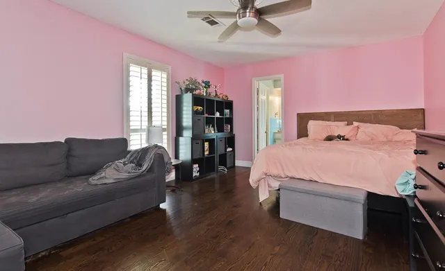 a bedroom with a bed furniture and a window