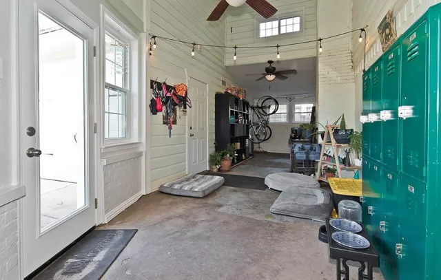 a view of a hallway with seating area