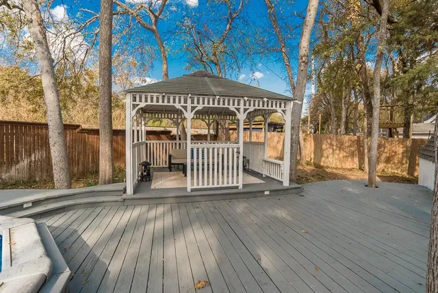 a view of a wooden house with a bench