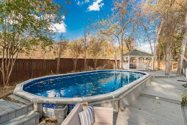 a view of swimming pool with outdoor seating