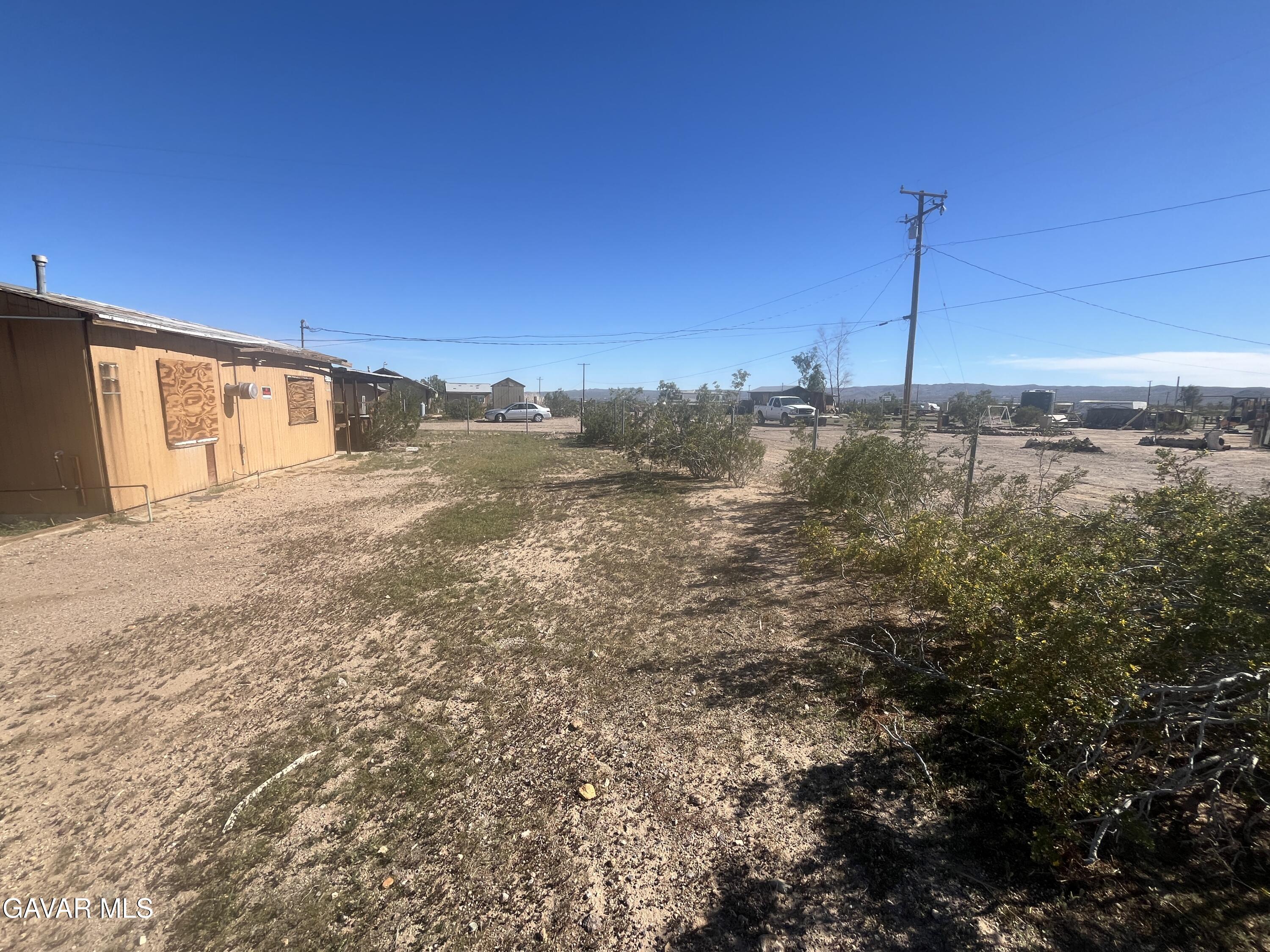 2206 Upjohn Avenue Ridgecrest, CA 93555 - Photo 5 of 12 a view of a yard with an ocean view
