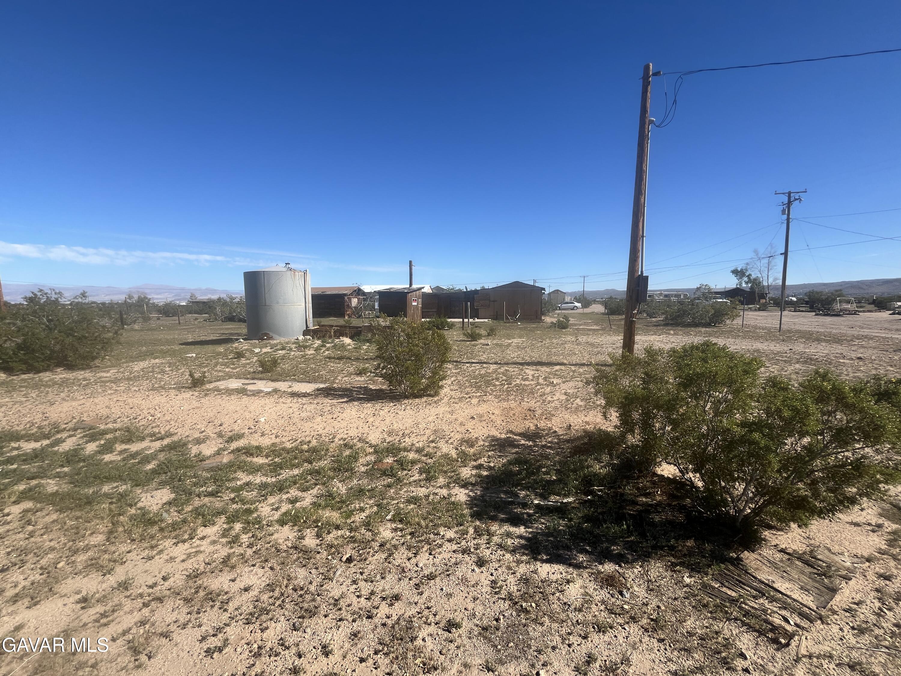 2206 Upjohn Avenue Ridgecrest, CA 93555 - Photo 7 of 12 a view of a house with a yard