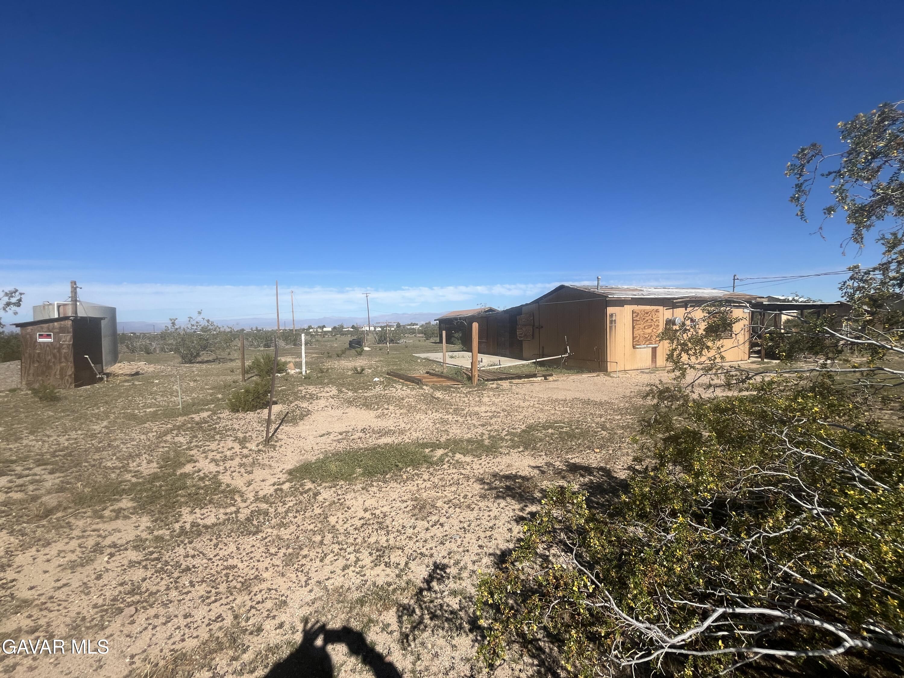 2206 Upjohn Avenue Ridgecrest, CA 93555 - Photo 8 of 12 a view of an outdoor space and a yard